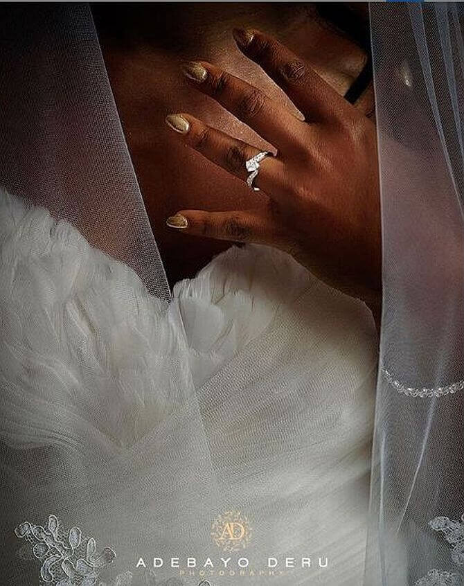 black woman showing wedding ring on hand