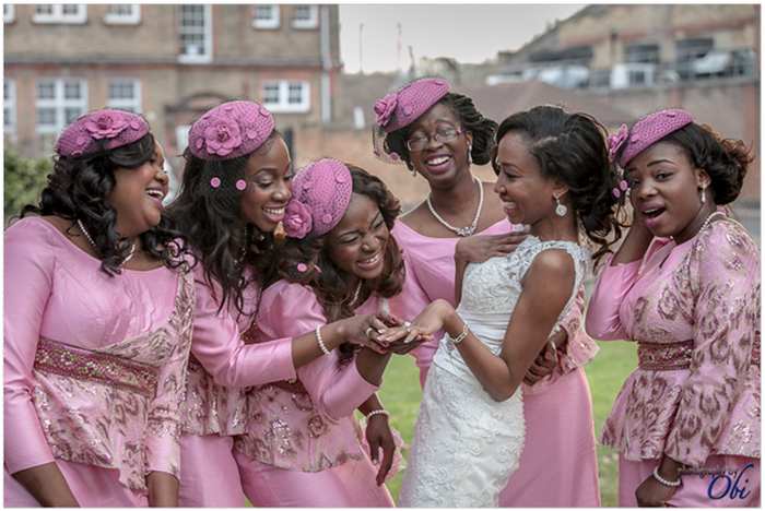 happy bride shows off wedding ring to bridesmaids