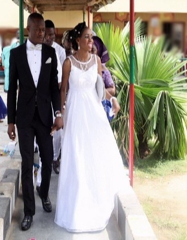 picture groom in black white suit n bride nigeria