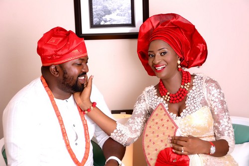 couple in red-themed traditional wedding picture