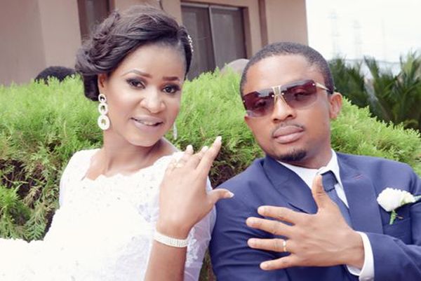 couple pose for pictures at their benin white wedding